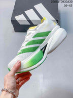 Side view of the shoe showing green stripes, a white upper, and a sculpted midsole.