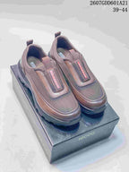 Pair of brown ECCO slip-on shoes displayed on a branded shoe box; source overlay shows style code 2607GDD601A21 and size range 39-44.