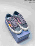 Pair of dark navy Vans Old Skool 36 sneakers with multicolor side detailing, white soles and a blue shoebox; size range text is visible at the top.