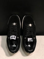 Top-down view showing black laces, padded collars, tongue labels and metal lace accessories.