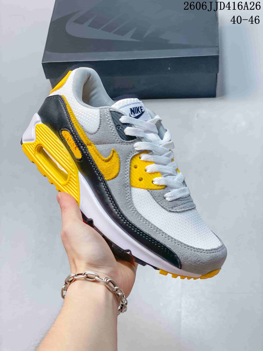 Gray, white, black and yellow Nike Air Max 90 sneaker