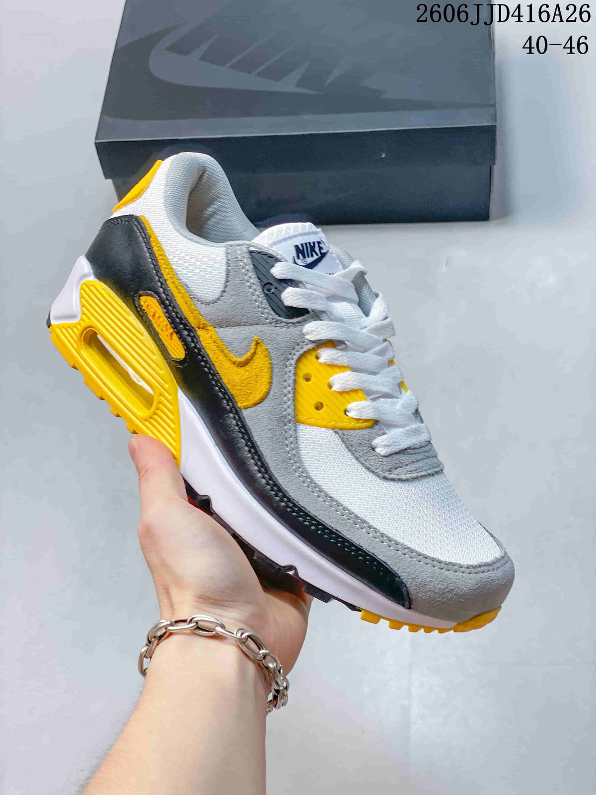 Gray, white, black and yellow Nike Air Max 90 sneaker