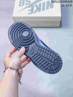Close-up of the patterned outsole on a blue Nike SB Dunk Low Pro sneaker