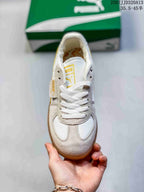 Top view showing the white laces, tongue branding, and contrasting light gray overlays.