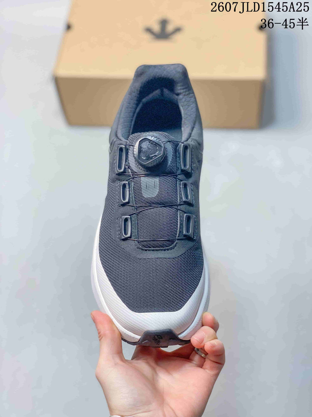 Top view showing the mesh-look toe, dial-style closure, and structured lace panels.