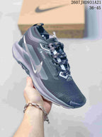 Angled side view of the dark gray trail sneaker showing the Nike logo, GORE-TEX marking, and layered outsole.