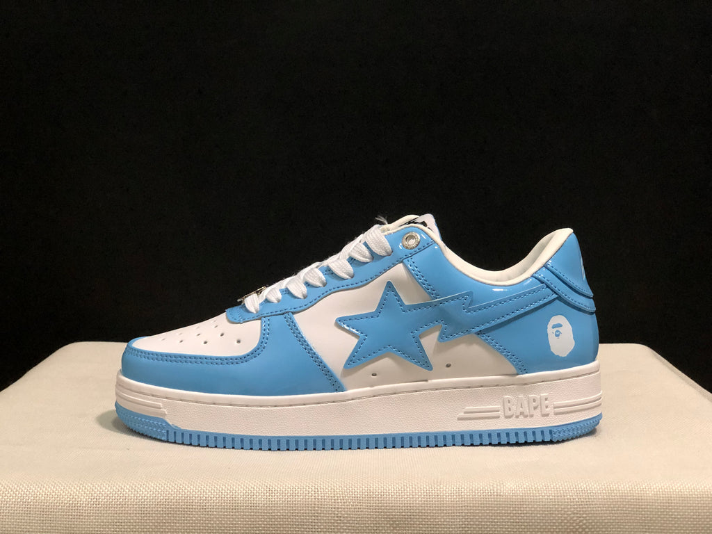 Side profile of a blue and white low-top sneaker showing the large star side panel and BAPE branding on the midsole.