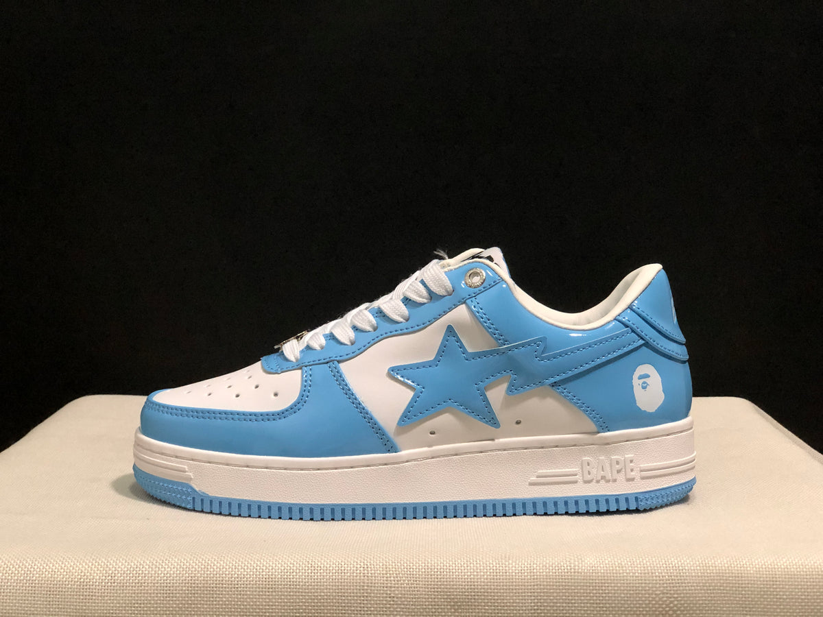 Side profile of a blue and white low-top sneaker showing the large star side panel and BAPE branding on the midsole.