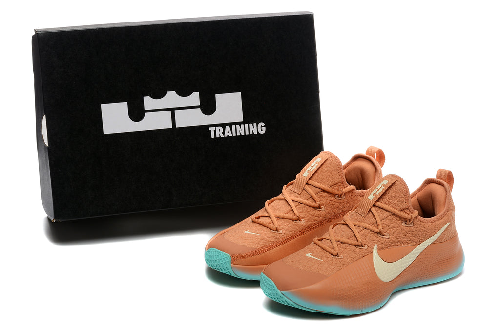 Warm orange LeBron TR1 shoes beside a black Training box
