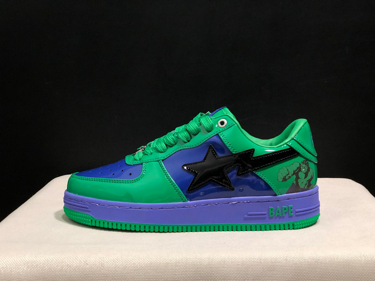 Side profile showing the glossy green and blue upper, black star-shaped side detail, purple midsole and green outsole.