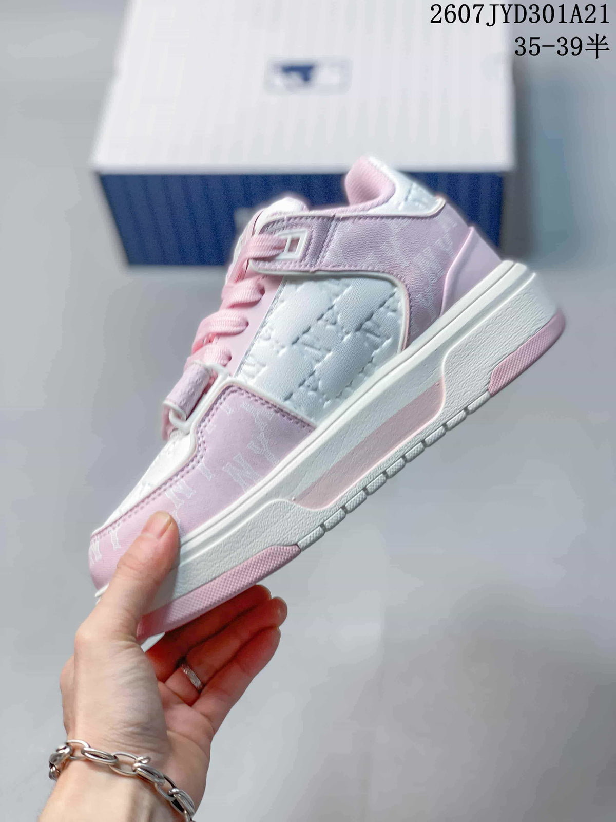 Side view showing the pink and white high-top sneaker, layered panels, laces, strap, and patterned outsole.