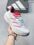 Angled side view highlighting the white low-top design, red accent stripes, red tongue and burgundy outsole.