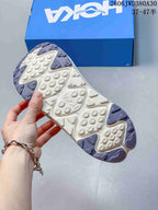 Underside of a HOKA Ora Primo EXT shoe showing its patterned outsole