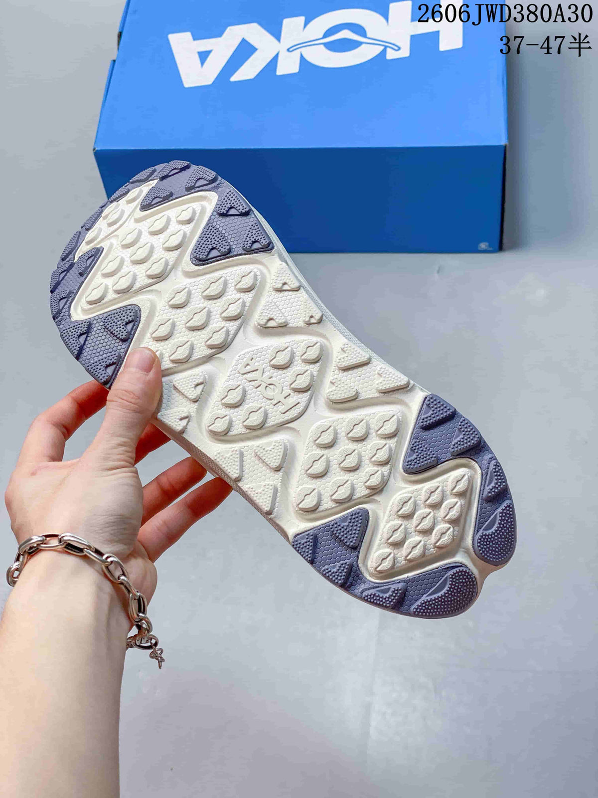 Underside of a HOKA Ora Primo EXT shoe showing its patterned outsole