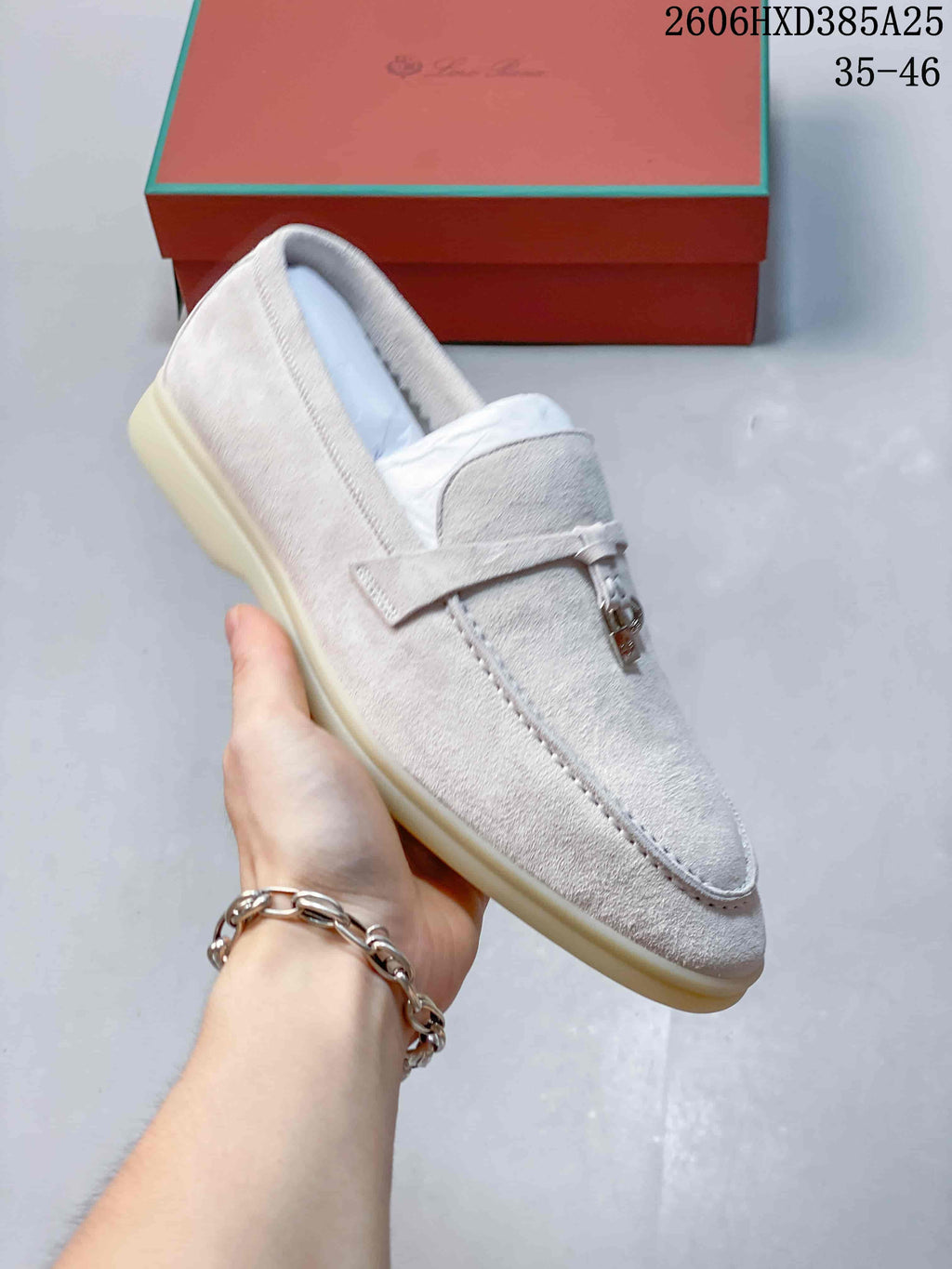 Angled view of the light beige loafer and its slip-on design