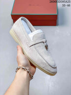 Angled view of the light beige loafer and its slip-on design