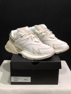 Pair of bone white AMIRI MA Runner sneakers displayed on a black shoe box; the box label shows size 41.