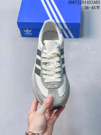 Top view of the lace-up Adidas sneaker with dark grey side stripes