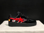Opposite side profile showing the glossy black upper, red star detail, shark graphic, and multicolor heel letter.