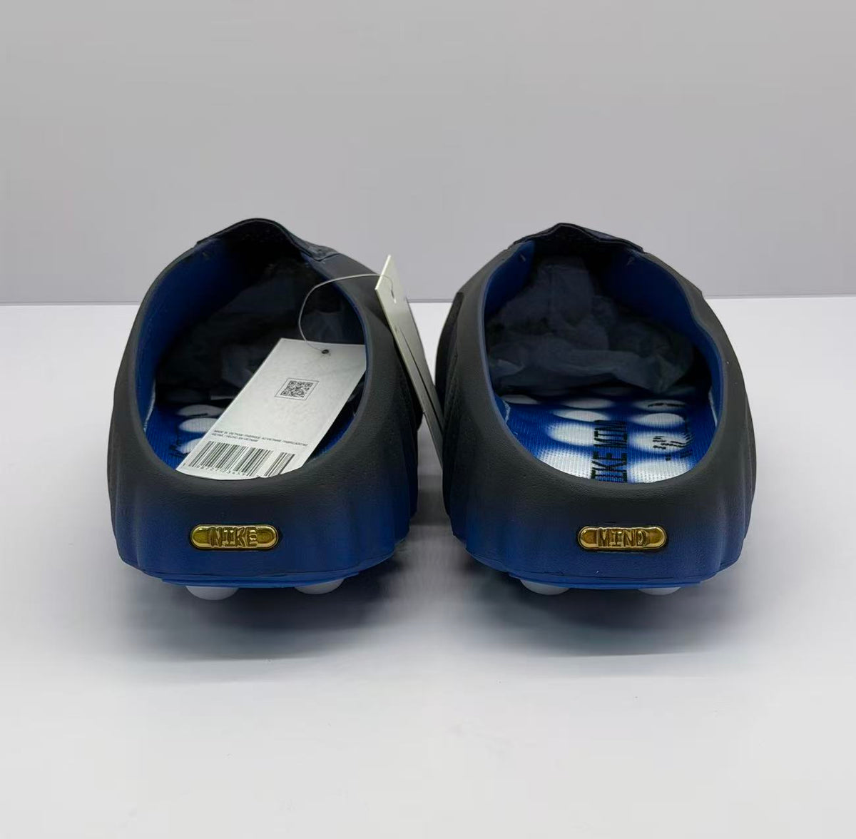 Rear view of the pair with gold heel plaques and blue interiors.