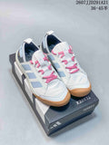 Pair of white adidas Daroga outdoor shoes with pale blue stripes, pink laces and gum-colored soles displayed on a TERREX box.