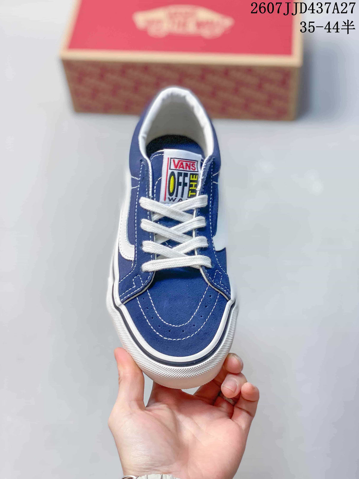 Top view of the blue sneaker showing white laces, stitched toe panel, and Vans tongue label.