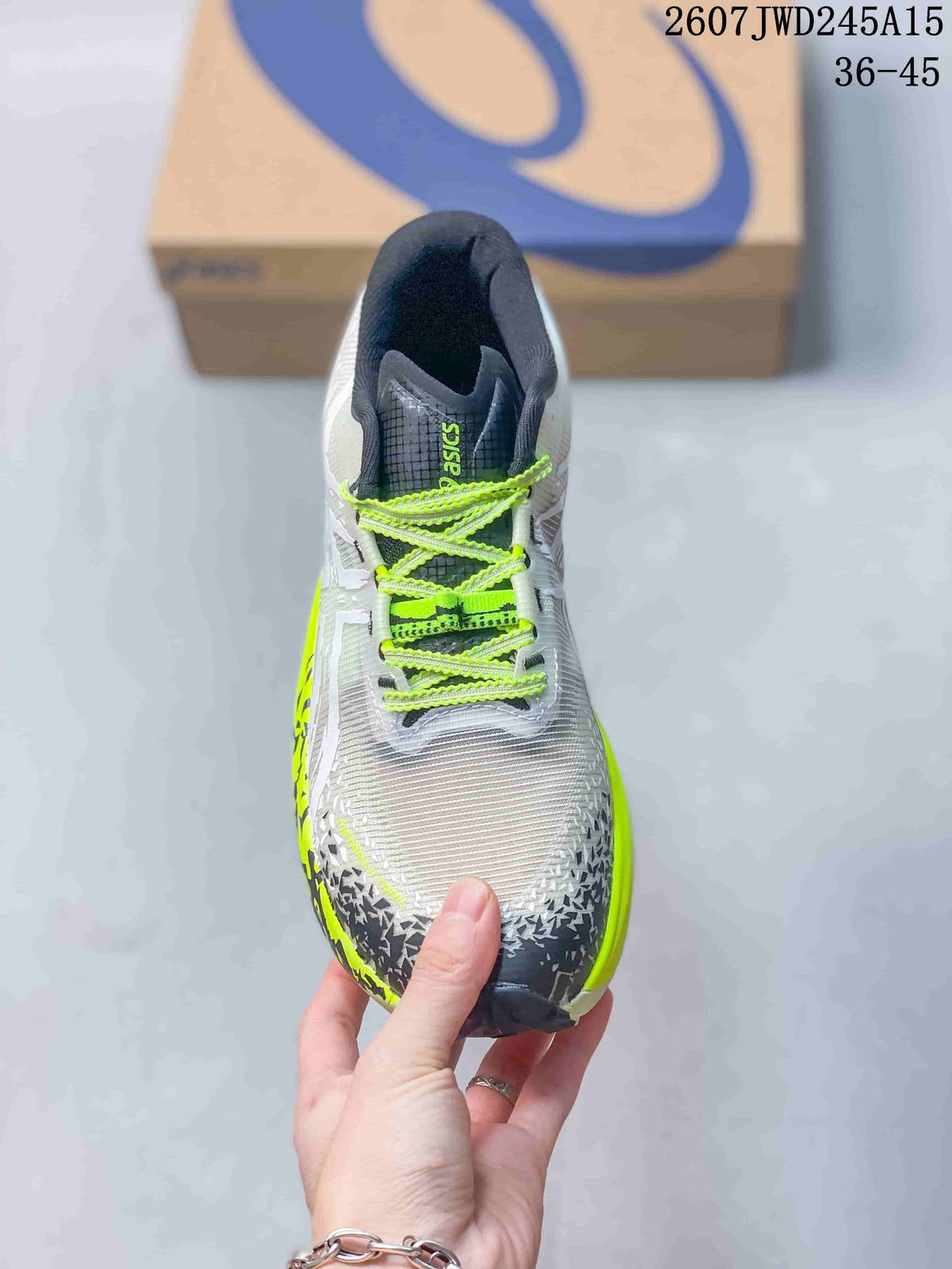 Top view of the sneaker showing neon yellow laces, dark tongue padding, and a textured white toe box.