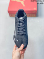 Top view of the black lace-up sneaker showing the Puma tongue label and toe logo.