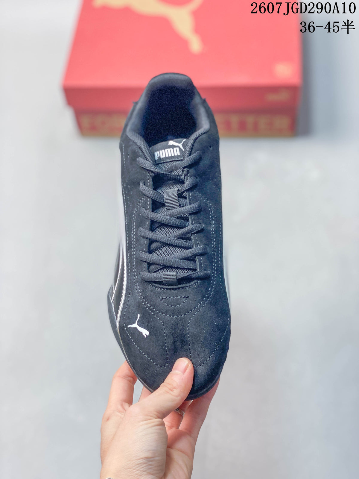 Top view of the black lace-up sneaker showing the Puma tongue label and toe logo.