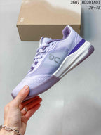 Side view of a light lavender and white On tennis shoe with grey side logo and patterned outsole; image overlay shows code 2607JHD201A01 and sizes 36–45.