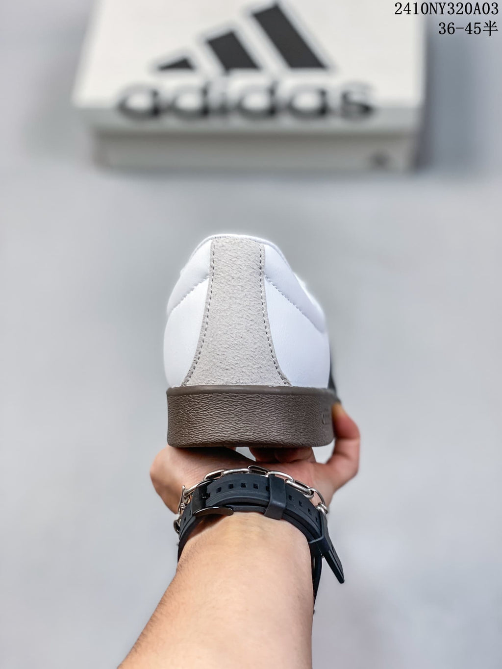 Rear view showing the white heel panels and brown gum-colored outsole.