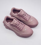 Top three-quarter view of a pair of pink alo lace-up sneakers.