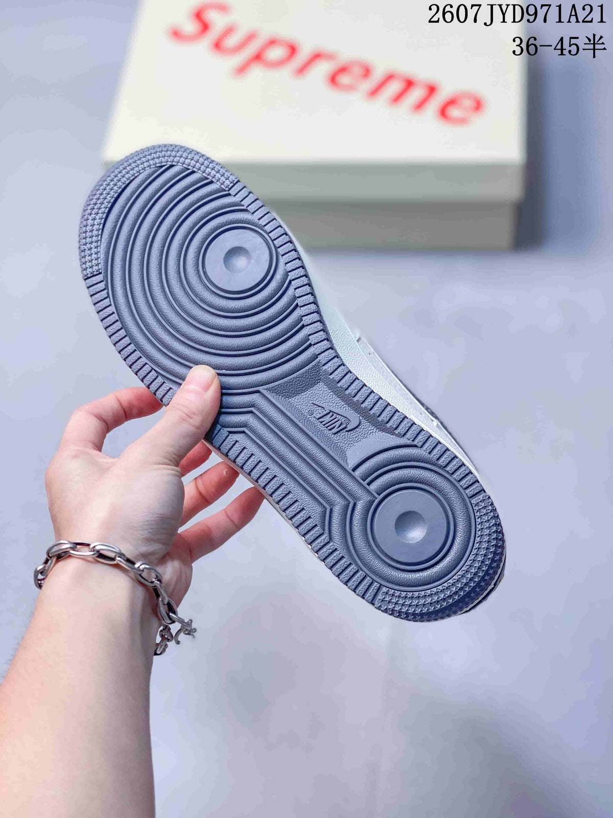 Close-up of the grey patterned outsole with concentric traction circles and visible Nike branding.