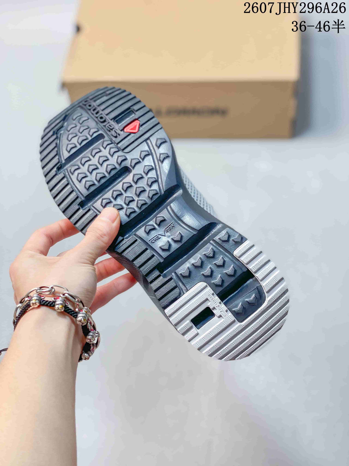 Close view of the Salomon mule outsole showing a textured lugged tread pattern and geometric traction details.