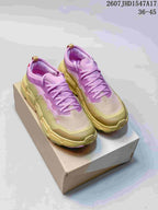 Pair of pink and yellow On CloudSoma sneakers displayed on a shoebox; the image also shows the source code 2607JHD1547A17 and size range 36–45.