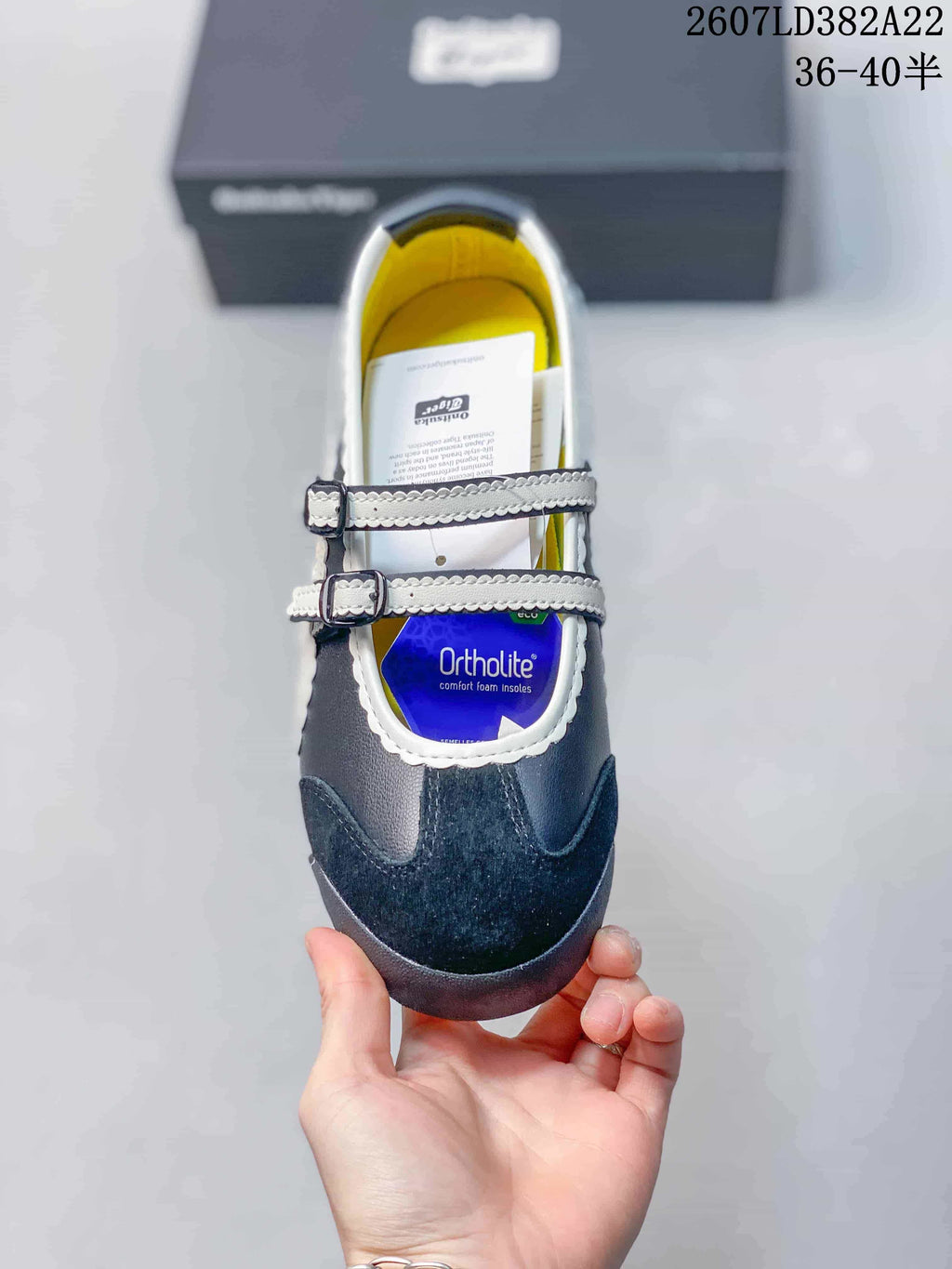 Top view of the sneaker showing the two buckle straps, textured toe panel, yellow lining and Ortholite-branded insole label.