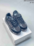 Pair of dark navy and gray Premiata Lander trainers displayed on a Premiata shoe box; overlay shows 2607JLD242A22 and 39–46.
