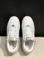 Top-down view showing the perforated toe boxes, white laces, padded collars, and branded insoles.