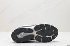Underside view showing the segmented black outsole with raised traction elements.