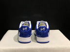 Rear view showing the blue heel panels, Bape Sta branding, white midsoles, and blue outsoles.