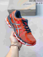 Angled side view of the red and orange ASICS Gel-Nimbus 16 shoe with black laces and contrasting sole.