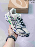 White and green ASICS GEL-Cumulus 16 sneaker with dark laces