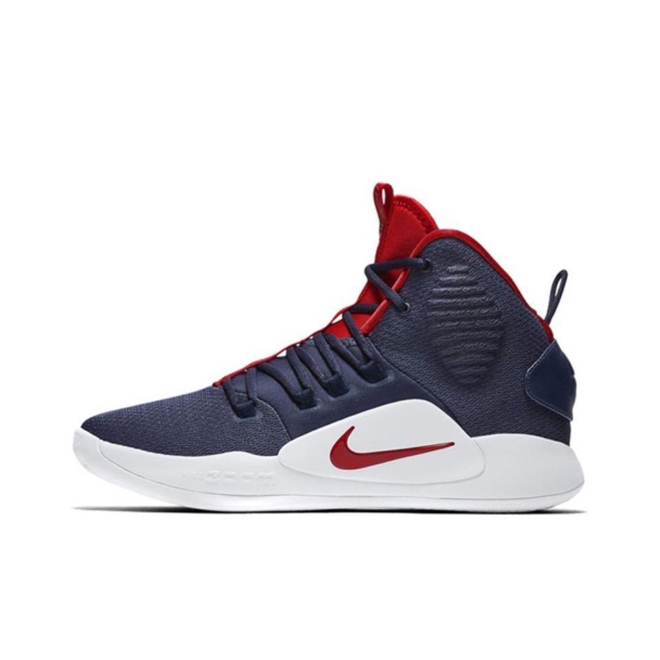 Side view of a navy and red Nike high-top basketball sneaker with a white sole.