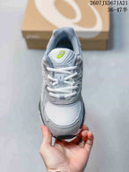 Top view of the sneaker showing the mesh toe box, white laces, padded tongue and lime-green ASICS logo.