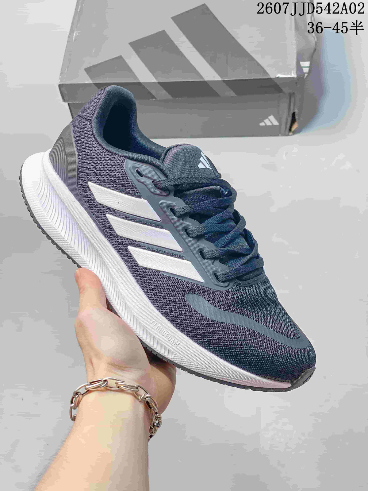 Gray adidas Runfalcon 5 shoe with white stripes and a white sculpted sole.