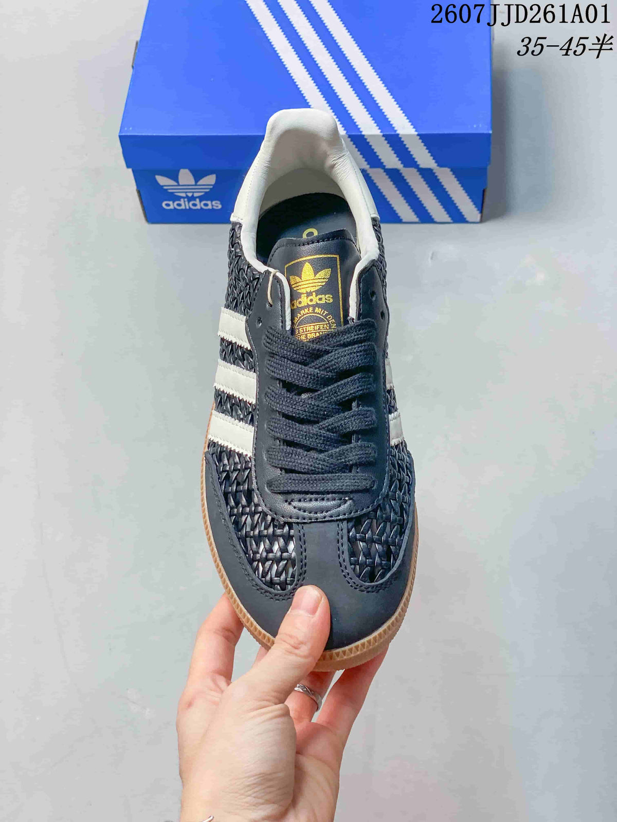 Top view of the dark lace-up sneaker with white side stripes