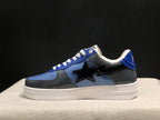 Side profile of a blue and gray Bape Sta sneaker with a black star detail and white platform-style outsole.