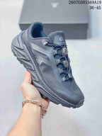 Close side view of a dark gray KAILAS trail shoe showing the structured upper, quick-lacing hardware and textured outsole.