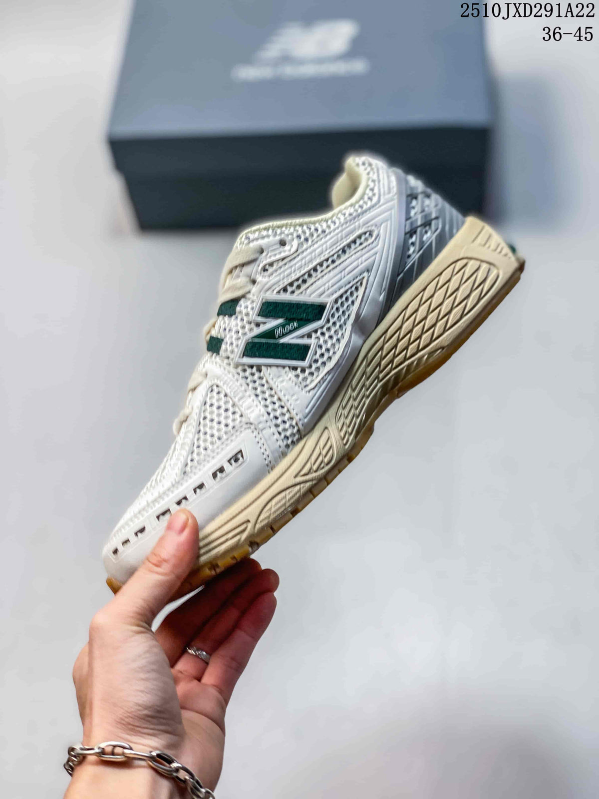 Side view of a New Balance 1906AD sneaker with a mesh upper, dark green logo detail, and cream midsole; image also shows the printed size range 36–45.