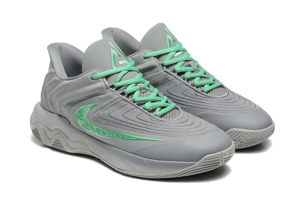Pair of gray sneakers with mint-green laces and side emblems